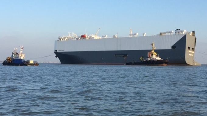 The righted Hoegh Osaka car transporter ship finally under tow back to Southampton Docks. Photo: Mick Hopley