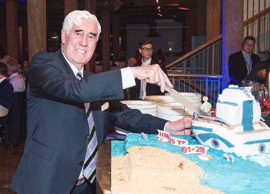 IIMS founder and first President, Capt Bill MacDonald, cuts the cake. Photo by Kirk Schwarz - www.kirkschwarz.co.uk