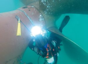 Diver/technician re-welding the rope guard after shaft seal replacement