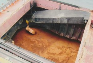 Solid bulk cargoes are typically “two-phase” materials as they contain water between the solid particles.