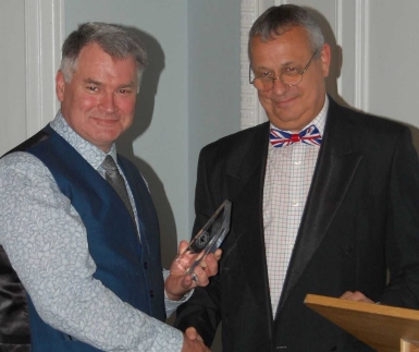 Mark Ford (pictured left) is presented with his Blue Water Award by Mike Schwarz