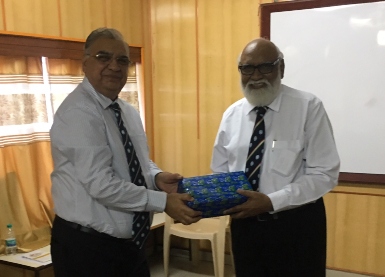 Capt. Mukesh Gautama presents a gift of appreciation to Tony Fernandez