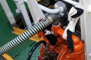 Ships are dumping oily wastewater illegally by using a bilge pump.