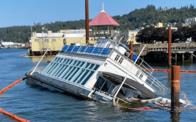 historic ferry Tourist II partially sank at a pier in Astoria, Oregon